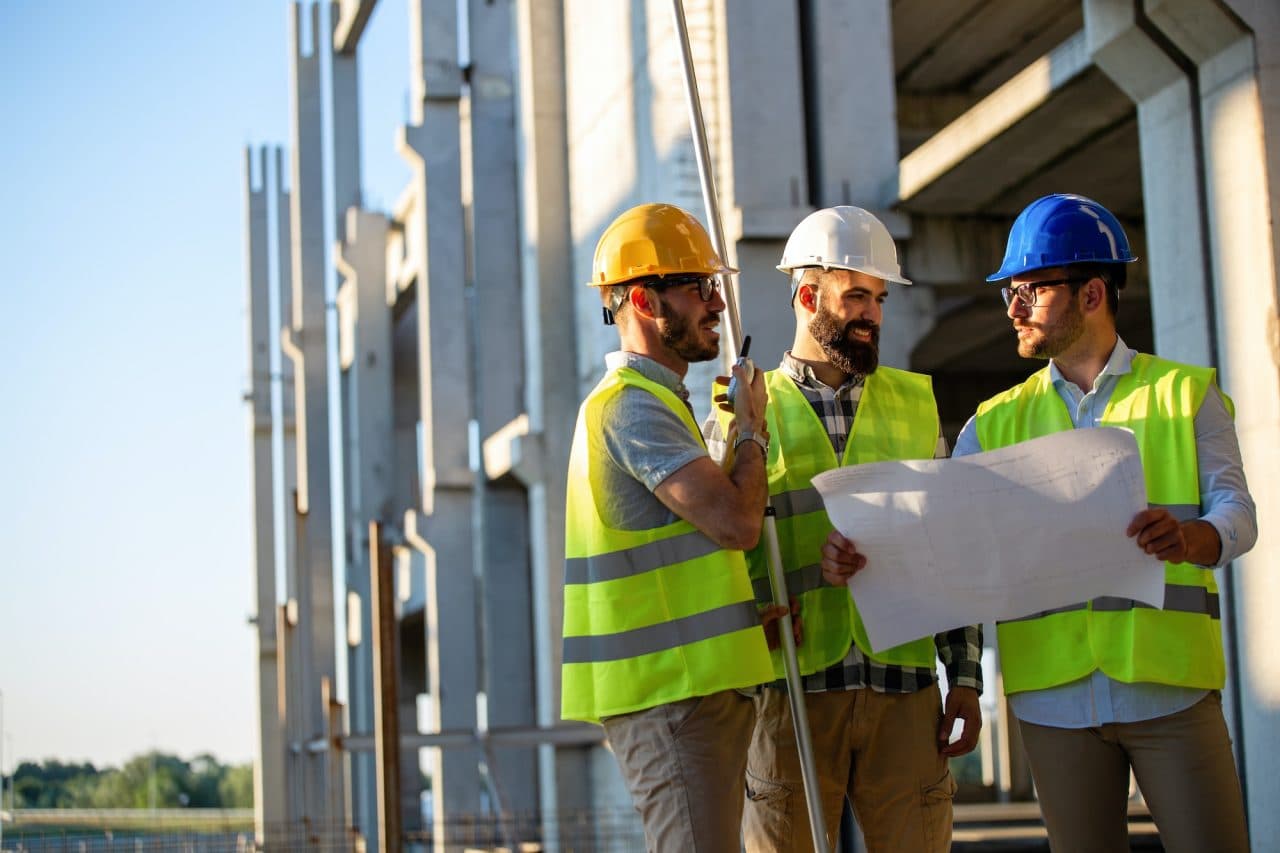 Construction professionals coordinating work on site